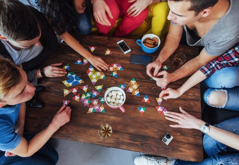 Young people playing board games